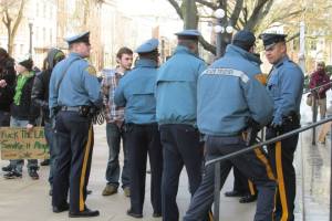 Organizer Kyle Moore speaking with police at State House. (Photo by Ken Wolski) 