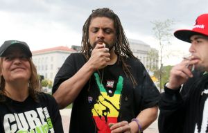 From Left to Right: Cindy Ruggiero, NJ Weedman, and David Okrod lighting up at City Hall. (Photo by NJ.com)